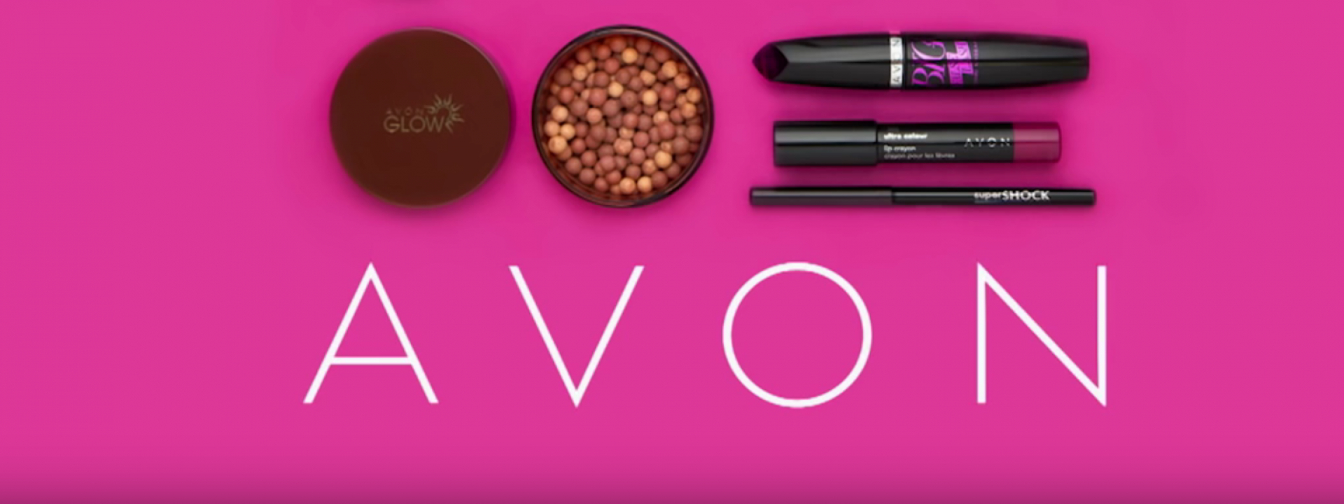 Pink background with Avon branded makeup products