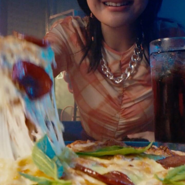 Close up of pizza and teenagers for Deliveroo campaign by GOVT VCCP