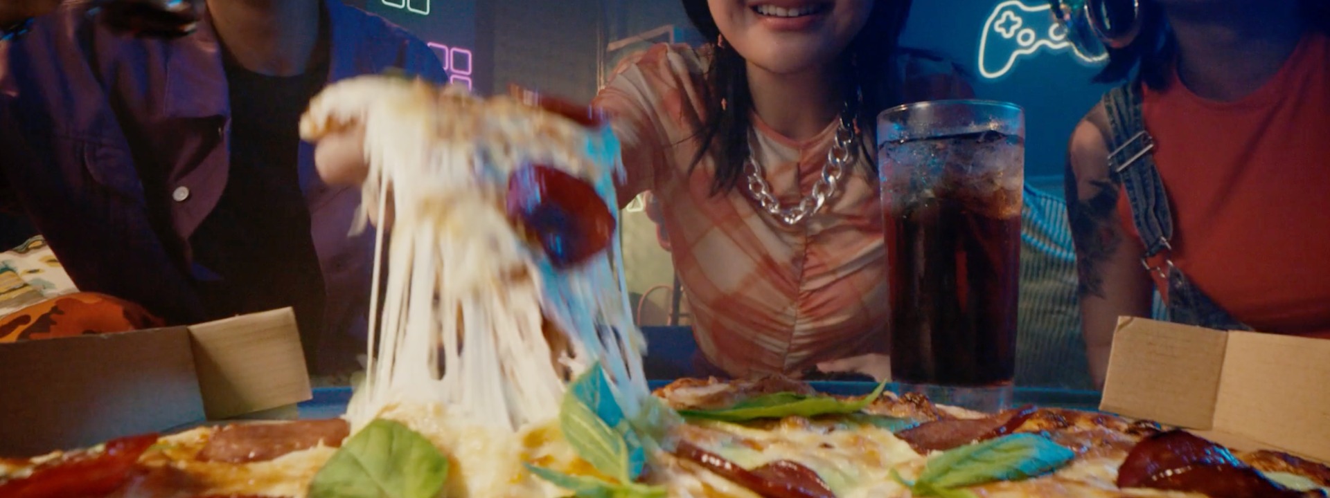 Close up of pizza and teenagers for Deliveroo campaign by GOVT VCCP