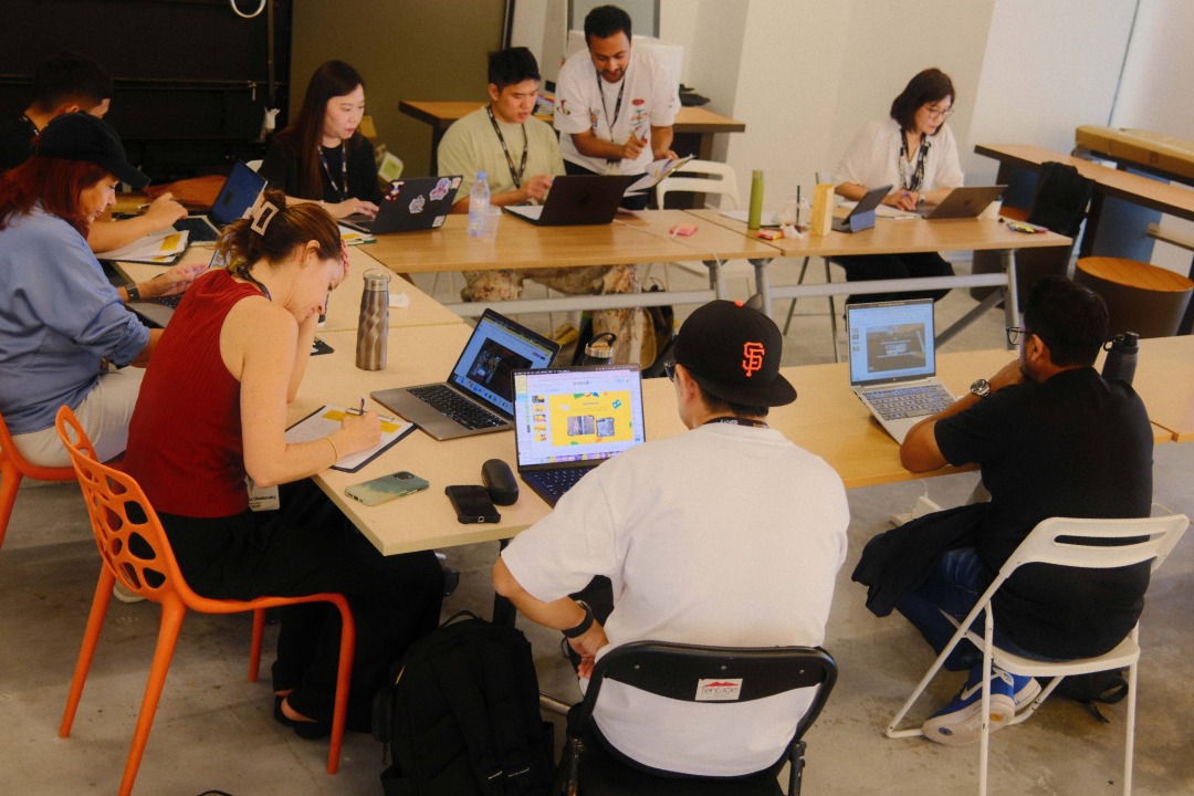Group of people sat down for a mentoring session for young creatives in Singapore
