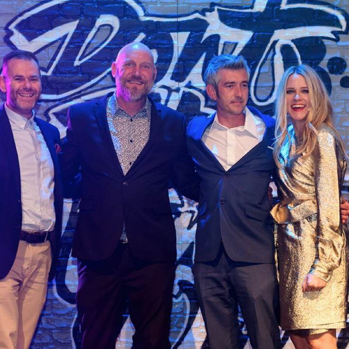 A group of people at an awards ceremony