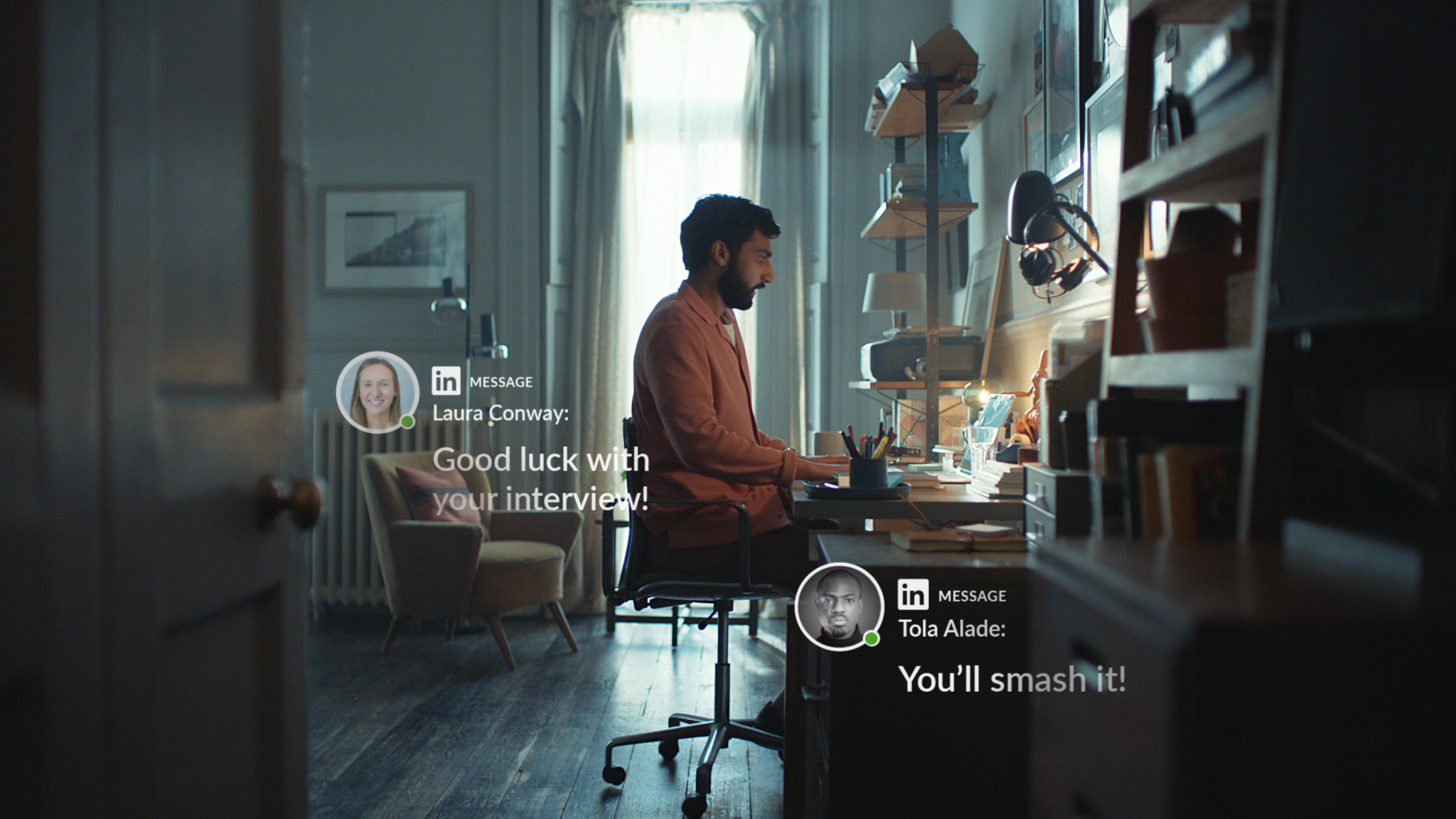 A man sitting at a desk on his laptop. Text reads: good luck with your interview!