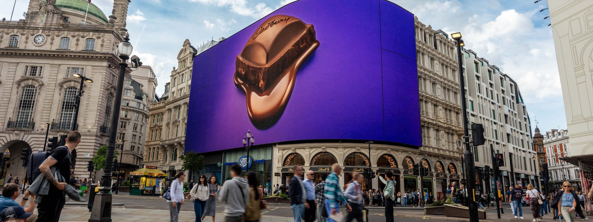 A melting piece of Cadbury Dairy Milk chocolate displayed on the Piccadilly Lights screen in London, as part of Cadbury's global campaign.