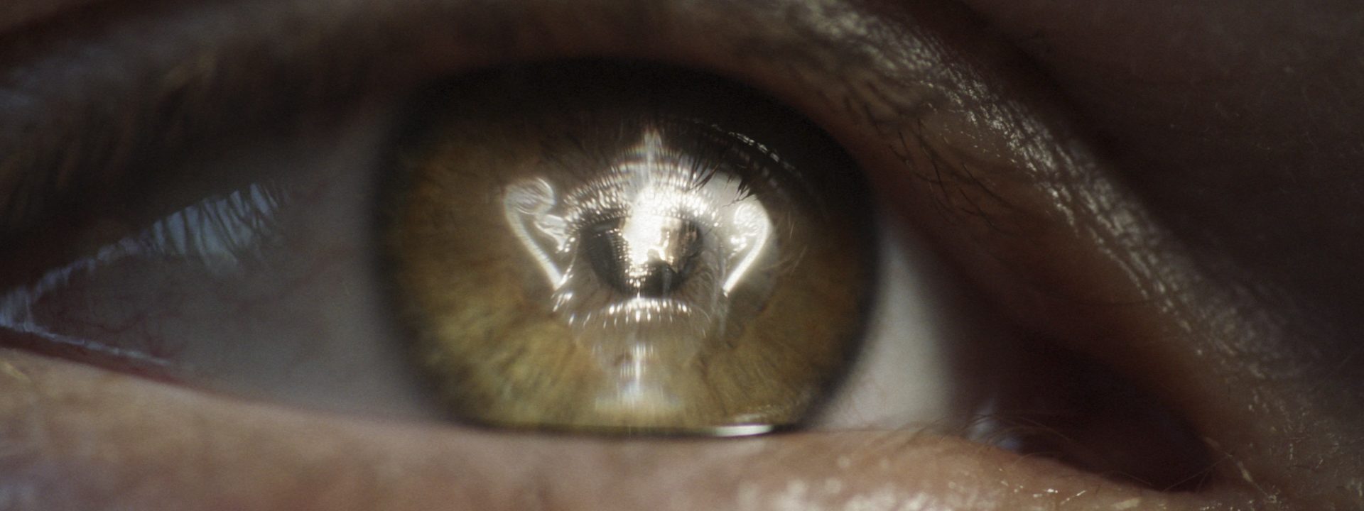 Close up of eye with reflection of the Wimbledon Tennis trophy
