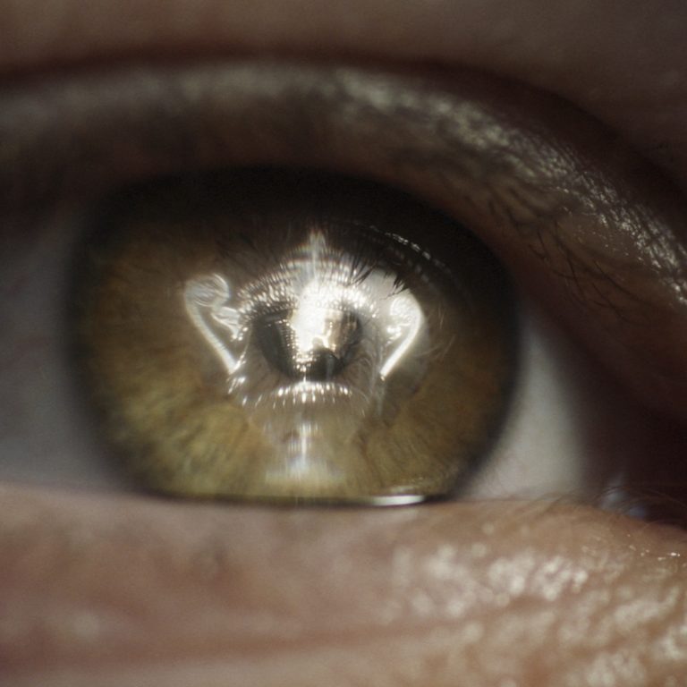 Close up of eye with reflection of the Wimbledon Tennis trophy