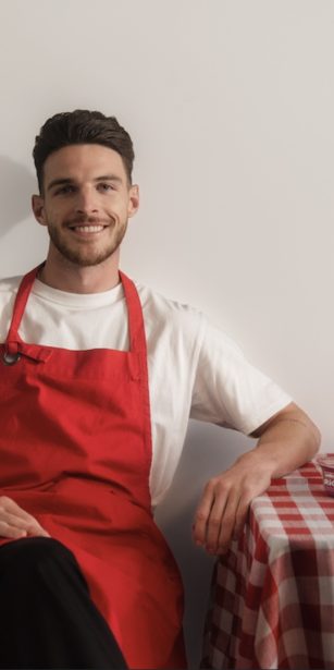 Declan Rice sat down at a checkered table with Muller rice branding