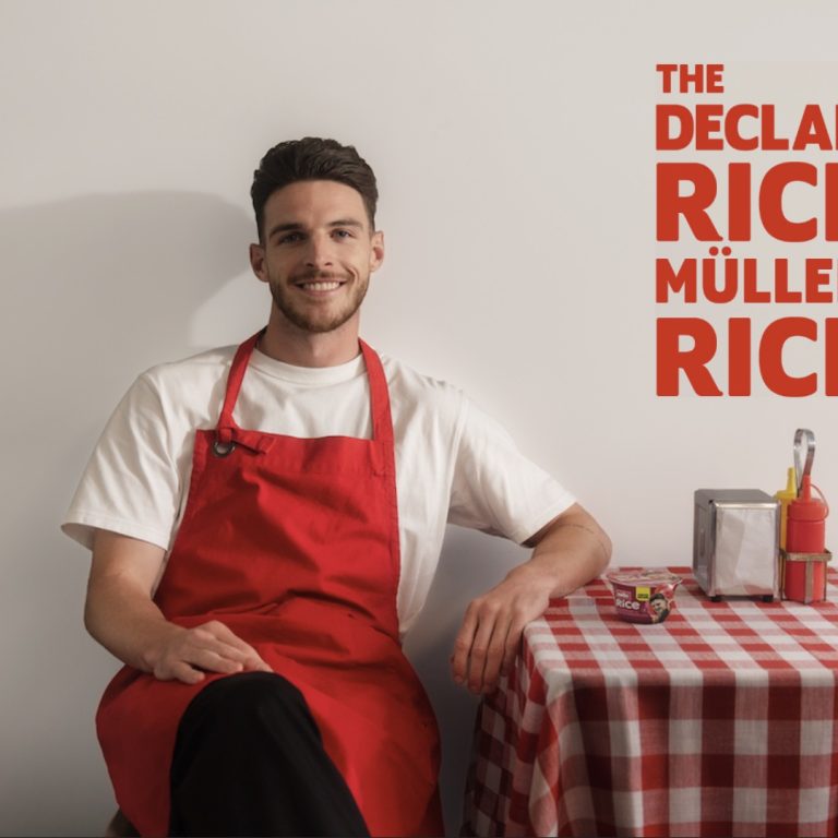 Declan Rice sat down at a checkered table with Muller rice branding