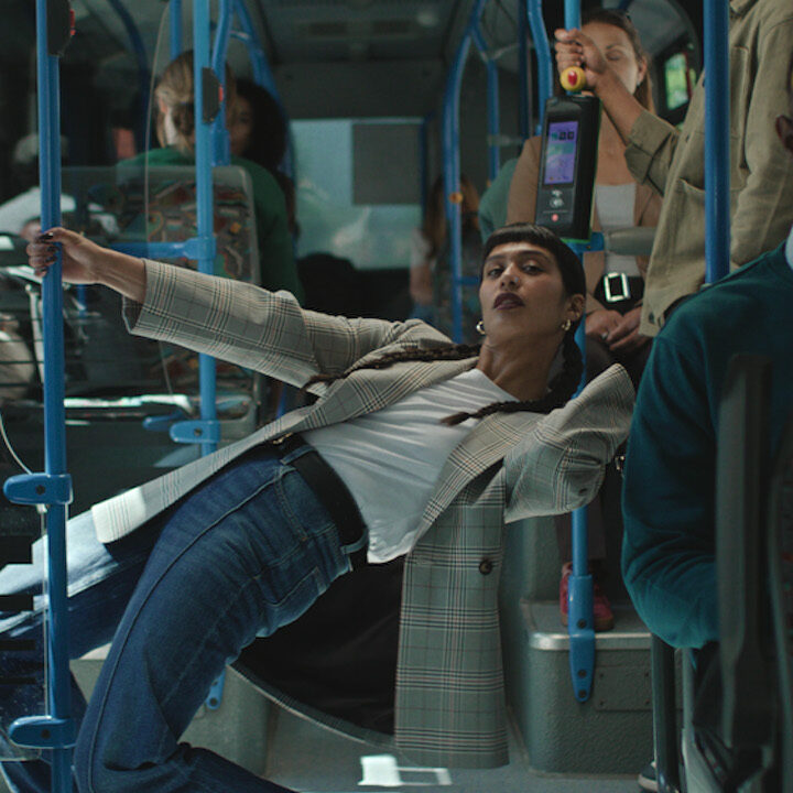 Woman in Primark jeans leaning inside bus for TV Ad