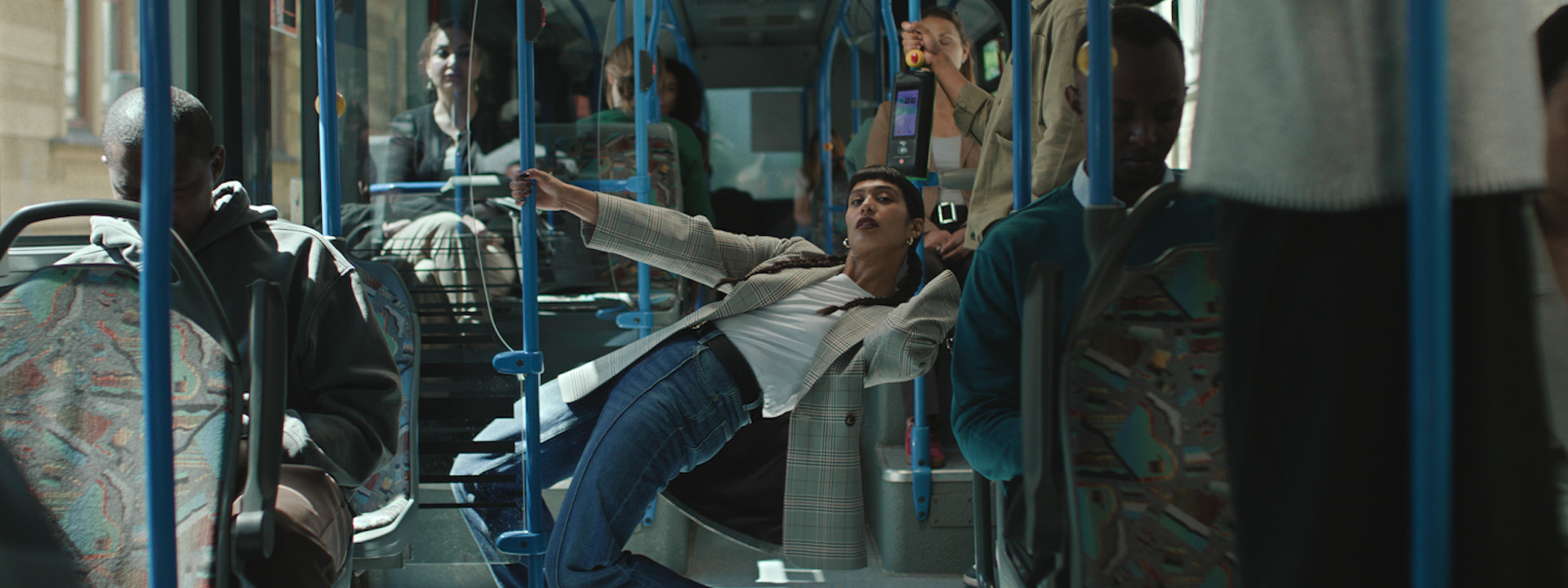 Woman in Primark jeans leaning inside bus for TV Ad