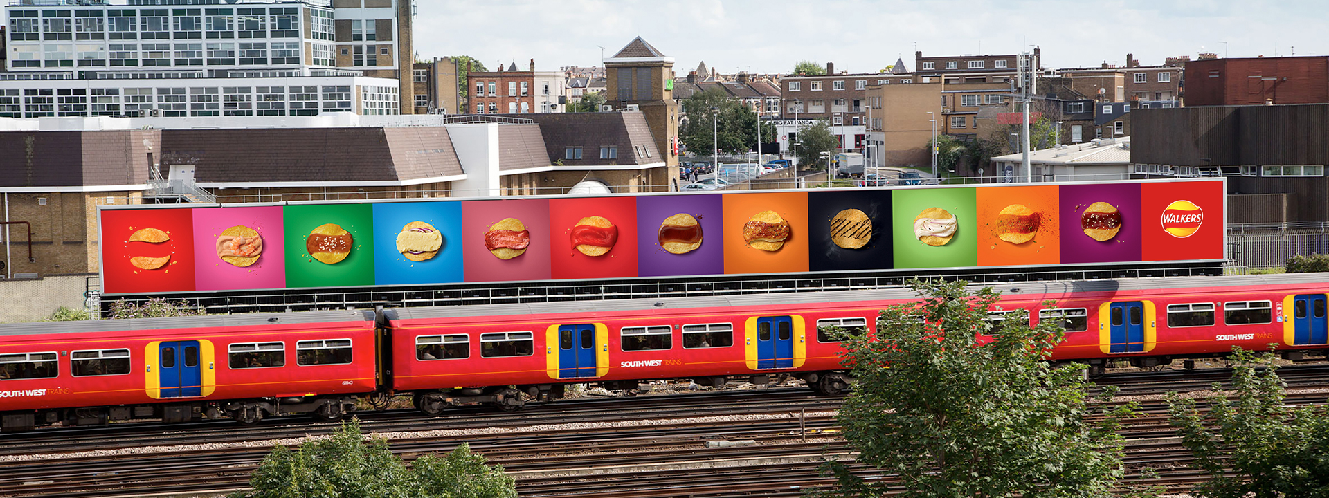 Train passing by large billboard with Walkers Crisp advert