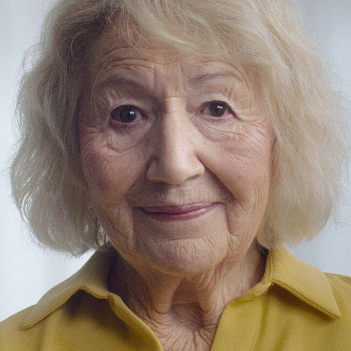Close up of elderly woman in yellow shirt for Co-Op FuneralCare Ad