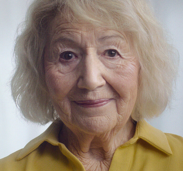 Close up of elderly woman in yellow shirt for Co-Op FuneralCare Ad
