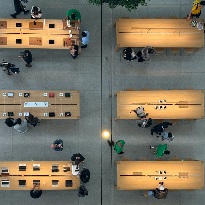 top down view of people at desks with laptops