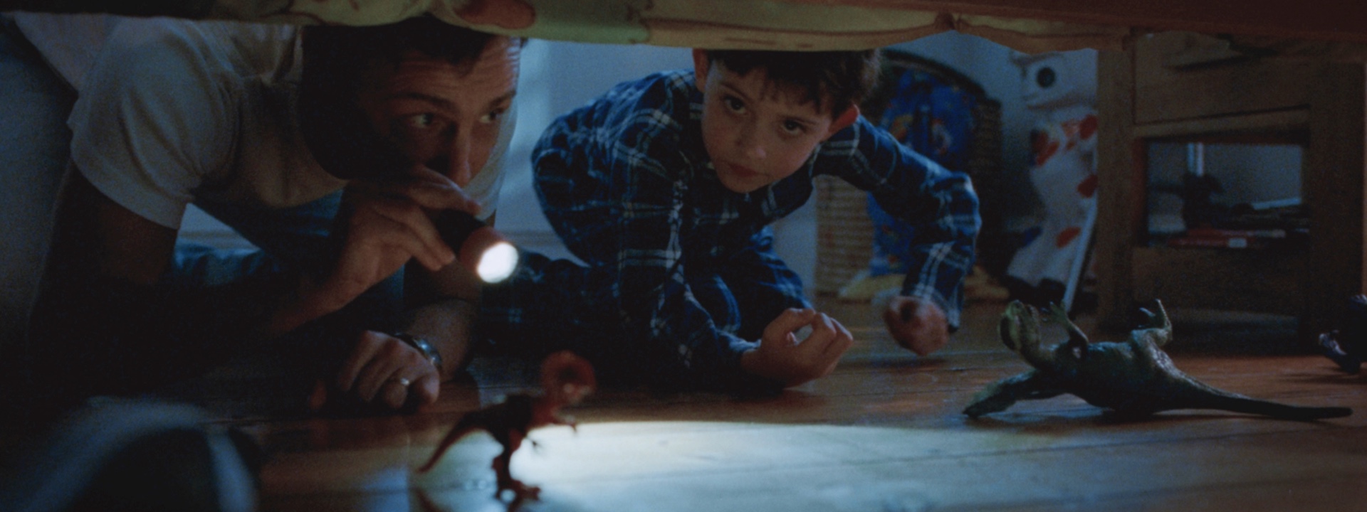 VCCP for Disney+ ad featuring a father and son looking under a bed for monsters