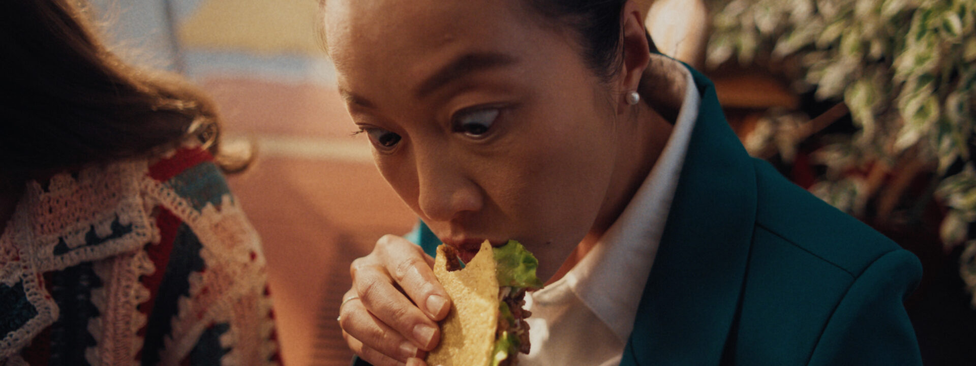 Woman eating a taco for an Ad campaign for Old El Paso