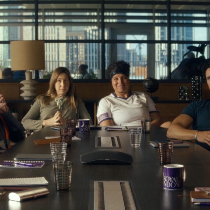 Group of people sat around a table in a board room, campaign for Royal London, VCCP