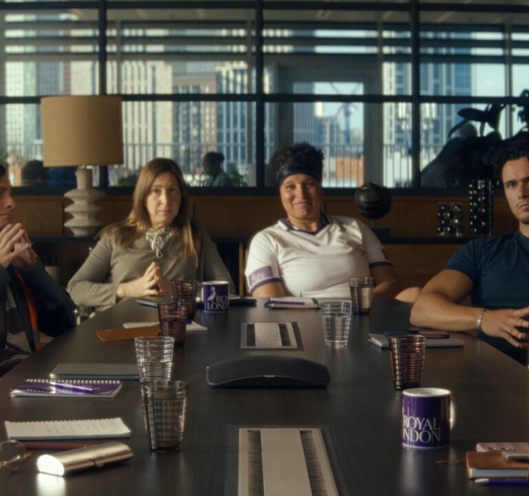 Group of people sat around a table in a board room, campaign for Royal London, VCCP