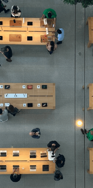 top down view of people at desks with laptops
