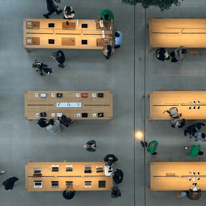 top down view of people at desks with laptops