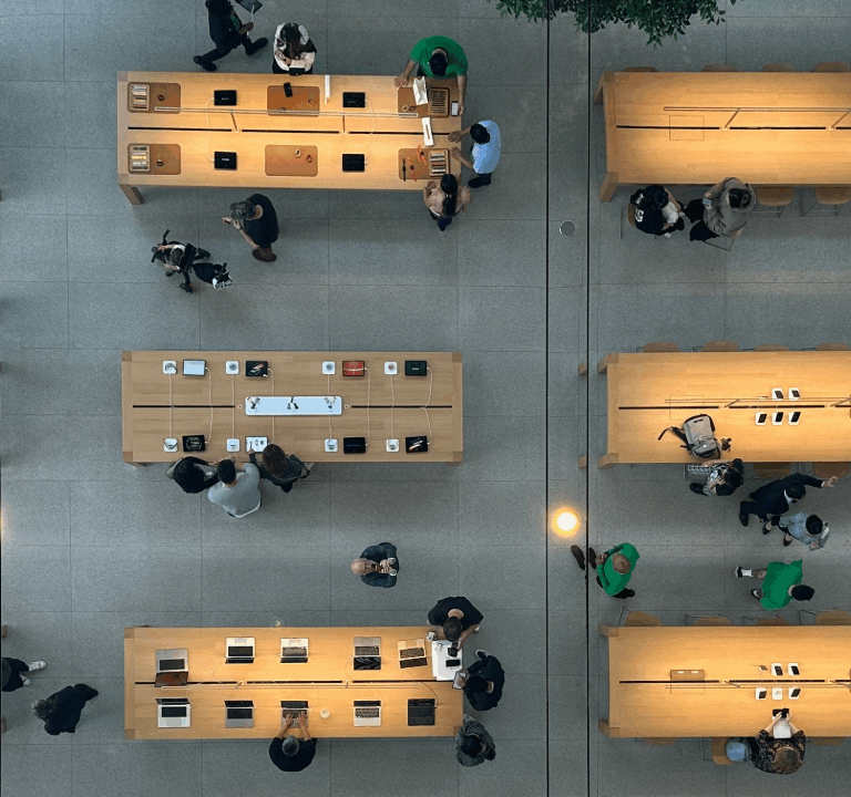 top down view of people at desks with laptops