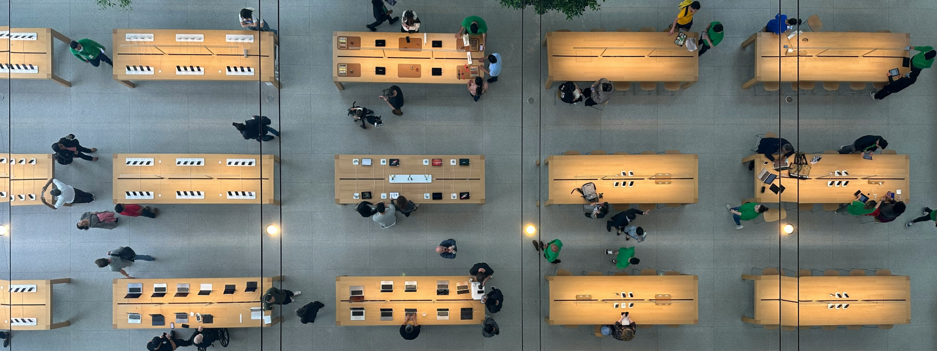 top down view of people at desks with laptops
